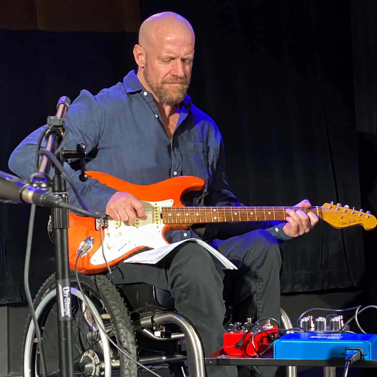 Sam Morris playing guitar live